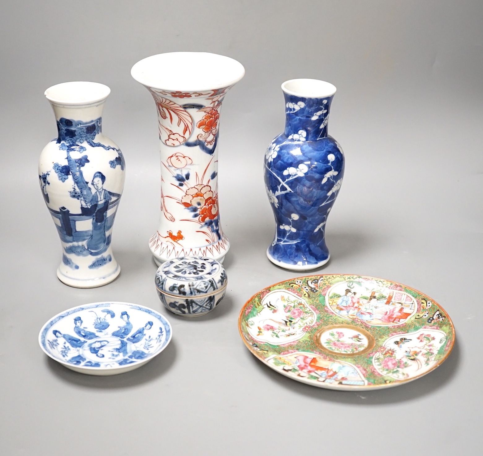 A Japanese Edo period Imari vase, 22. 5 cm, two 19th-century Chinese blue and white baluster vases, an Annamese blue and white box and cover, a Chinese famille rose plates and a blue and white dish